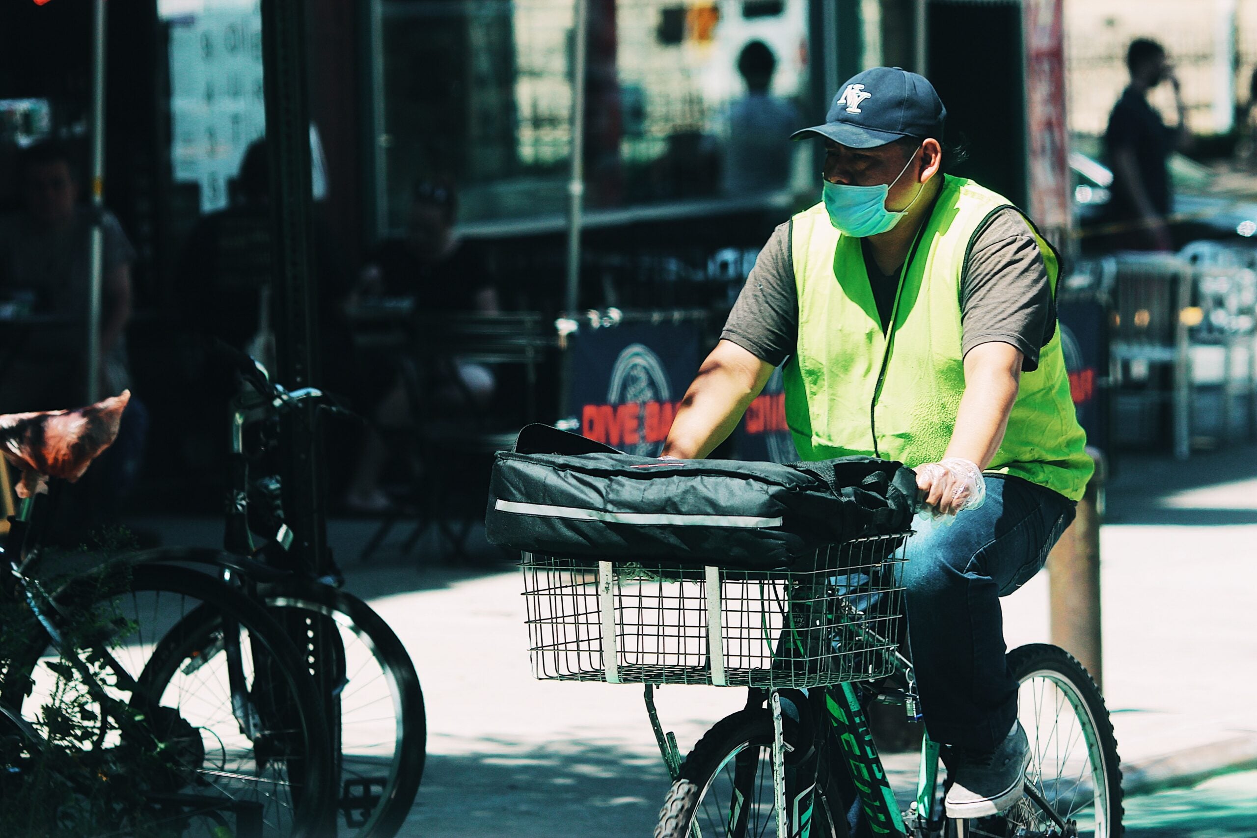 Delivery worker riding a bike.