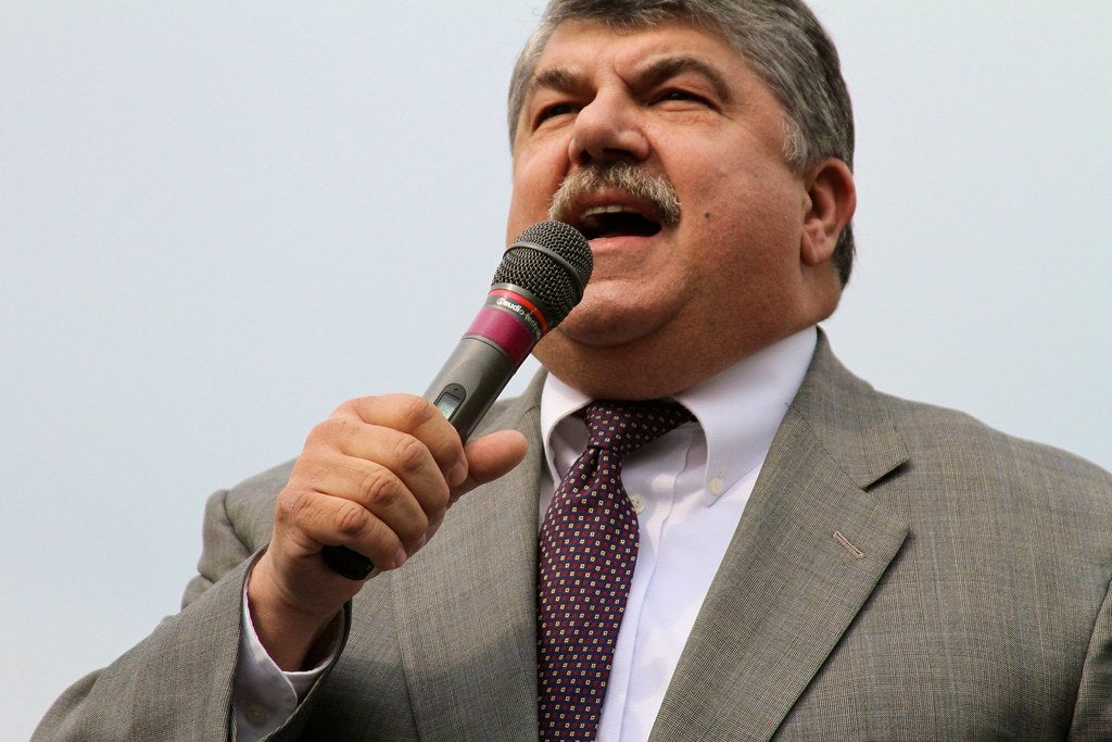 Richard Trumka speaking into a microphone.