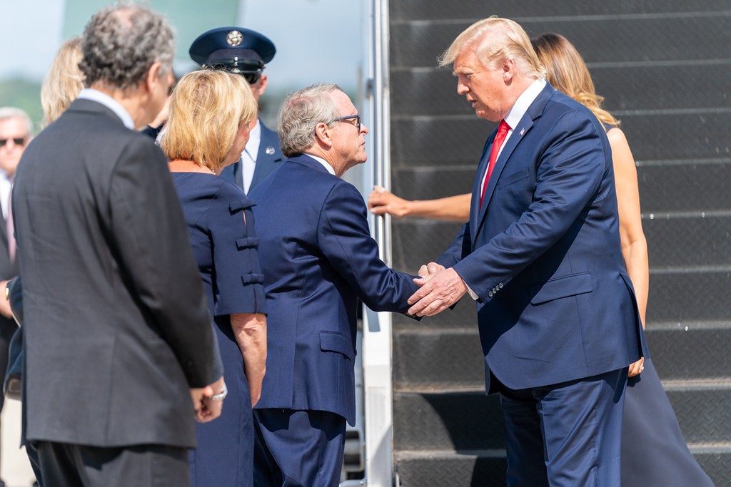 Donald Trump shaking a man's hand
